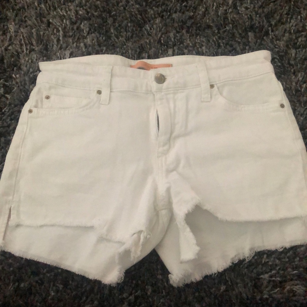 White denim shorts with fringe